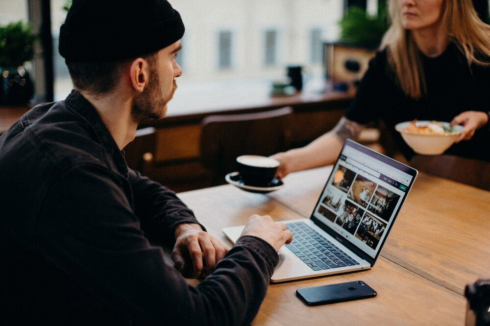 man-wearing-black-jacket-using-laptop-computer-sitting-3584926.jpg