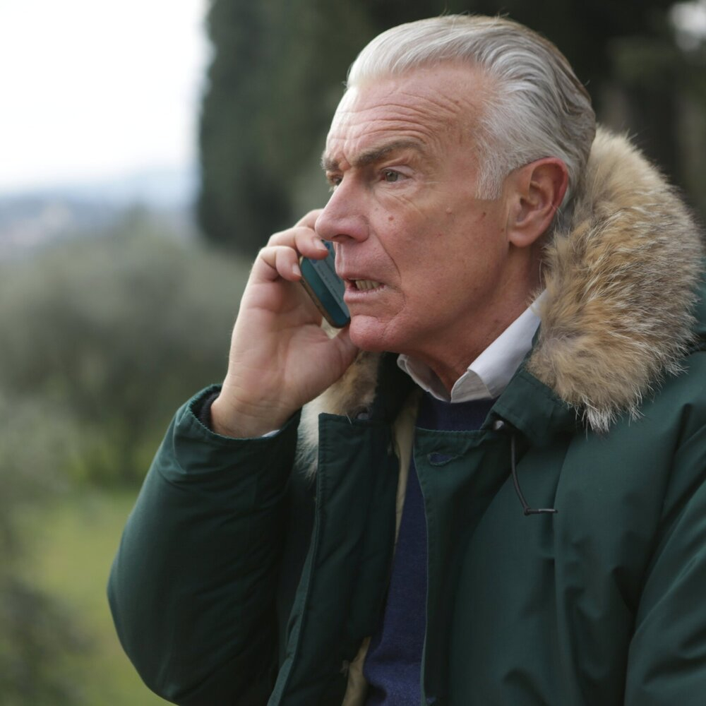 man-in-green-jacket-holding-phone-3782807.jpg