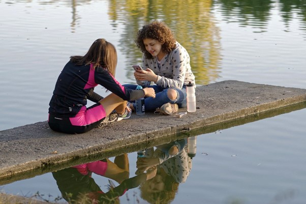 Children on lake with phone.jpg